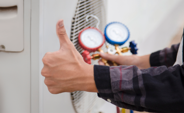 Technician is checking air conditioner ,measuring equipment for filling air conditioners.