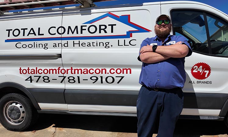 Total Comfort HVAC van with friendly, experienced service technician