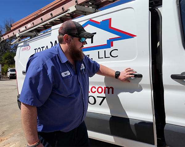 service technician entering Total Comfort van